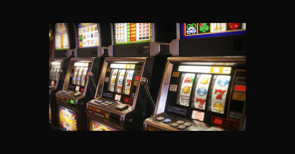 A row of classic slot machines on a dim casino flo | DavidP on ...