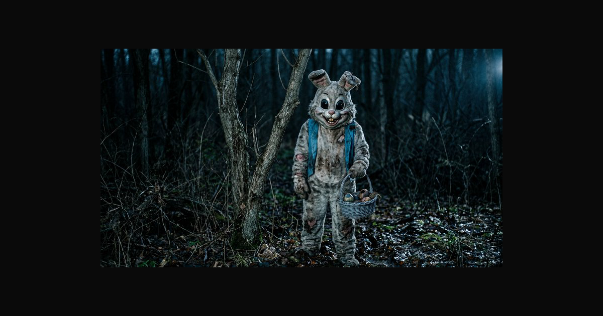 A eerie, life-sized rabbit costume stands in a dim | pajmeravilla on ...
